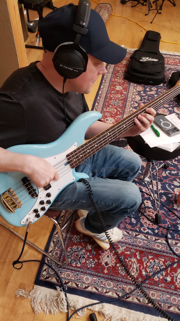 Justin Fedenyszen on electric bass.